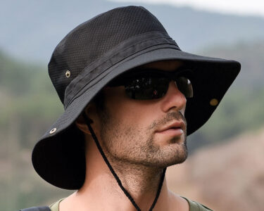 A man worn a black fishing hat