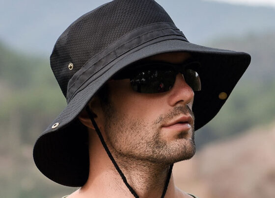 A man worn a black fishing hat